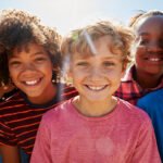 11-close-up-of-pre-teen-friends-in-a-park-smiling-to-PQKA7HP.jpg
